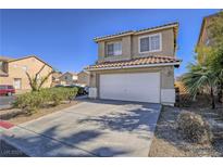 Charming two-story home features a two car garage, desert landscaping and tile roof at 5929 Sleepy Fawn Dr, Las Vegas, NV 89142