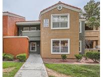 Inviting two-story condo featuring desert landscaping, and a charming entryway at 8101 W Flamingo Rd # 1164, Las Vegas, NV 89147