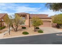 Charming single-Gathering home featuring a tile roof, desert landscaping, and an attached two-car garage at 1111 Casa Palermo Cir, Henderson, NV 89011