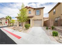 Two-story home showcasing a charming front exterior, attached garage and desert landscaping at 1130 Paradise Garden Dr, Henderson, NV 89002