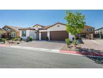 Charming single-story home with a two-car garage and well-maintained landscaping at 7821 Mazarine St, North Las Vegas, NV 89084