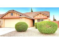 Charming single-story home with a tidy front yard and well-maintained landscaping with drought tolerant desert scape at 8120 Backpacker Ct, Las Vegas, NV 89131