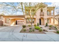 Beautiful two-story home with a porte-cochere and desert landscaping at 2805 Proust Ct, Henderson, NV 89044