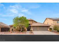 Charming single-Gathering home featuring a neutral-toned exterior, mature landscaping, and a convenient two-car garage at 5940 Vizzi Ct, Las Vegas, NV 89131