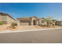 Charming single-story home with desert landscaping and a brick paved driveway at 10126 Cliff Dwellings Ave, Las Vegas, NV 89178