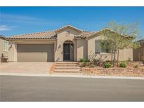 Charming single-story home with desert landscaping, a brick driveway, and a two-car garage at 10126 Cliff Dwellings Ave, Las Vegas, NV 89178