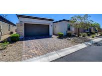 Charming single-Gathering home with brick paver driveway and desert landscaping at 8550 Lost Pony St, Las Vegas, NV 89148