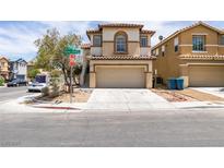 Two-story home featuring a neutral-colored exterior, two car garage and a well-maintained front yard at 11668 Tierney Creek Dr, Las Vegas, NV 89183
