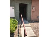 Inviting entrance with a security gate and landscaped pathway at 461 N Lamb Blvd # H, Las Vegas, NV 89110