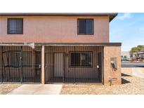 Charming townhome featuring a secure, gated front porch and two-story facade at 3508 Rio Robles Dr # A, North Las Vegas, NV 89030