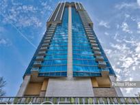 Striking, modern Palms Place high-rise building against a vibrant blue sky at 4381 W Flamingo Rd # 1109, Las Vegas, NV 89103
