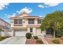 Charming two-story home features a well-manicured front yard, two-car garage and a classic design at 5148 Forest Oaks Dr, Las Vegas, NV 89149