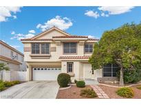 Charming two-story home with a tile roof, well-manicured landscaping, and an attached two-car garage at 5148 Forest Oaks Dr, Las Vegas, NV 89149