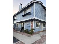 Charming two-story exterior with blue siding, brick accents and a well-maintained front yard at 5365 Shake Ct # 103, Las Vegas, NV 89122
