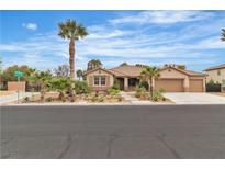 Charming single-story home boasts mature landscaping, a three-car garage and a well-manicured front yard at 5889 Taylor Valley Ave, Las Vegas, NV 89131