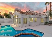 Backyard pool and patio with sunset views add appeal to this custom single story home at 8125 Sunset Cove Dr, Las Vegas, NV 89128