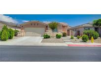 Charming single-story home featuring a two-car garage, low-maintenance landscaping and a concrete driveway at 7822 Whitlocks Mill Ave, Las Vegas, NV 89147