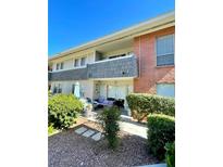 Charming condo exterior with a private patio, lush landscaping, and beautiful brick accents at 682 Oakmont Ave # 1507, Las Vegas, NV 89109