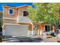 Charming two-story home featuring a two-car garage and a welcoming entrance; holiday decor on display at 11117 Romola St, Las Vegas, NV 89141
