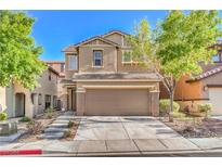 Inviting two-story home with a well-maintained front yard and a two-car garage at 137 Desert Pond Ave, Henderson, NV 89002