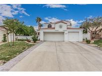 Charming two-story home with a tile roof, well-maintained landscaping, and an attached two-car garage at 227 Drysdale Cir, Henderson, NV 89074