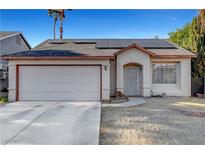 Charming single-story home featuring desert landscaping, solar panels, and a two-car garage at 2504 Soldier Creek Ct, Las Vegas, NV 89106