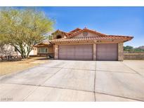 Charming home featuring a terracotta roof, a two-car garage, and desert-friendly landscaping at 266 Cordero Dr, Henderson, NV 89074