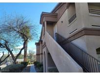 Exterior view of the condo showing the stairs leading up to the unit at 5750 E Hacienda Ave # 117, Las Vegas, NV 89122