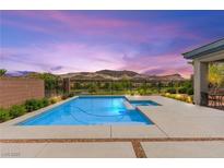 Inviting pool with mountain views and landscaped surroundings for relaxing outdoor living at 59 Reflection Bay Dr, Henderson, NV 89011