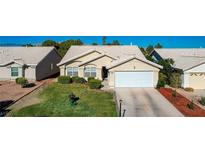 Charming single story home with a manicured lawn and two car garage at 5508 Lochmor Ave, Las Vegas, NV 89130