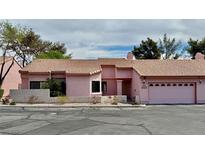 Charming single-story home with a well-maintained front yard and attached two-car garage at 680 Cervantes Dr, Henderson, NV 89014