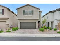 Charming home featuring a well-kept front yard and an attached two-car garage at 7006 Sylmar Ave, Las Vegas, NV 89113