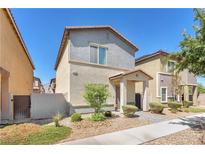 Charming two-story home with well-maintained landscaping and a welcoming entrance at 7323 Sunray Point St, North Las Vegas, NV 89084