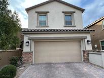 Charming two-story home with a two-car garage and well-maintained landscaping at 8111 Switchback Run St, Las Vegas, NV 89166