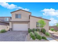 Charming two-story home with stucco siding, desert landscaping, and a two-car garage at 9212 Lunar Effect St, Las Vegas, NV 89143