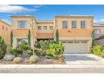 Charming two-story home featuring a two-car garage and desert landscaping at 1604 Danielle Rebecca Ave, North Las Vegas, NV 89086