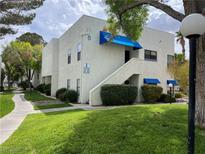 Exterior view of a two-story condo building with well-maintained landscaping and inviting walkways at 2637 Red Rock St # 202, Las Vegas, NV 89146