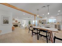 Bright and airy living room showcasing a fireplace and dining area that leads to a modern kitchen at 5904 Apple Valley Ln, Las Vegas, NV 89108