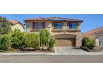 Charming two-story home with a tile roof, solar panels, and well-maintained landscaping at 6032 S Pioneer Way, Las Vegas, NV 89113