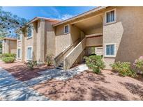 Inviting multi-story building with classic architectural details and well-maintained landscaping at 7200 Pirates Cove Rd # 2071, Las Vegas, NV 89145