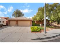 Charming single-story home with a well-manicured front yard, two-car garage, and inviting curb appeal at 7517 Elk Meadows Ct, Las Vegas, NV 89131