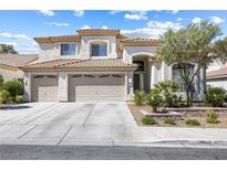 Inviting two-story home with a three-car garage, landscaped yard, and tile roof at 9916 Dusty Winds Ave, Las Vegas, NV 89117
