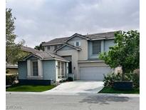 Charming two-story home featuring a two-car garage, landscaped yard, and classic suburban appeal at 10381 Walking View Ct, Las Vegas, NV 89135