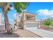 Charming two-story home featuring a balcony, two-car garage, and landscaped front yard at 6536 Castor Tree Way, Las Vegas, NV 89108