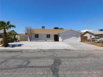 Charming single-story home featuring a low-maintenance rock garden and an attached two-car garage at 1075 Greymouth St, Las Vegas, NV 89110
