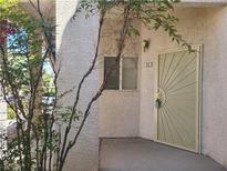 Inviting entryway with a decorative front door and textured stucco exterior for a secure and stylish entrance at 2117 Echo Bay St # 102, Las Vegas, NV 89128