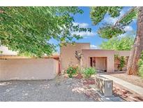 Charming single-story home with stucco exterior, desert landscaping and inviting front entryway at 4237 Brockton Green Ct, Las Vegas, NV 89110
