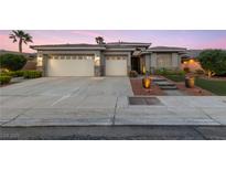 Attractive single-story home featuring a spacious three-car garage and manicured landscaping at 616 Canyon Brook Pl, Las Vegas, NV 89145