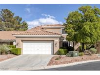 Inviting home with a two car garage, beautiful plants and desert landscaping at 1912 Summer Pine Ct # 103, Las Vegas, NV 89134