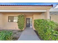 Inviting front entrance with decorative door and lush landscaping creating a welcoming curb appeal at 2851 S Valley View Blvd # 1026, Las Vegas, NV 89102
